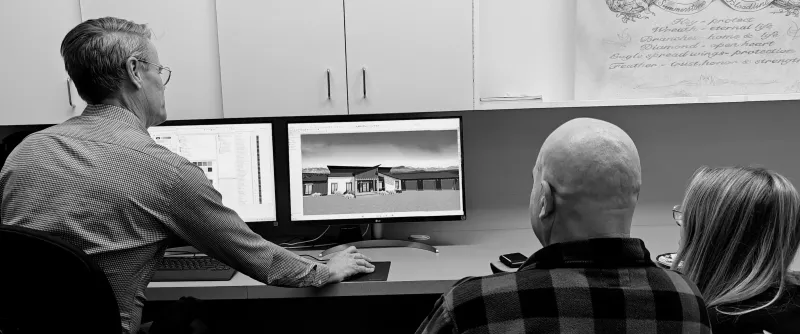 Greg working with clients on custom home plan